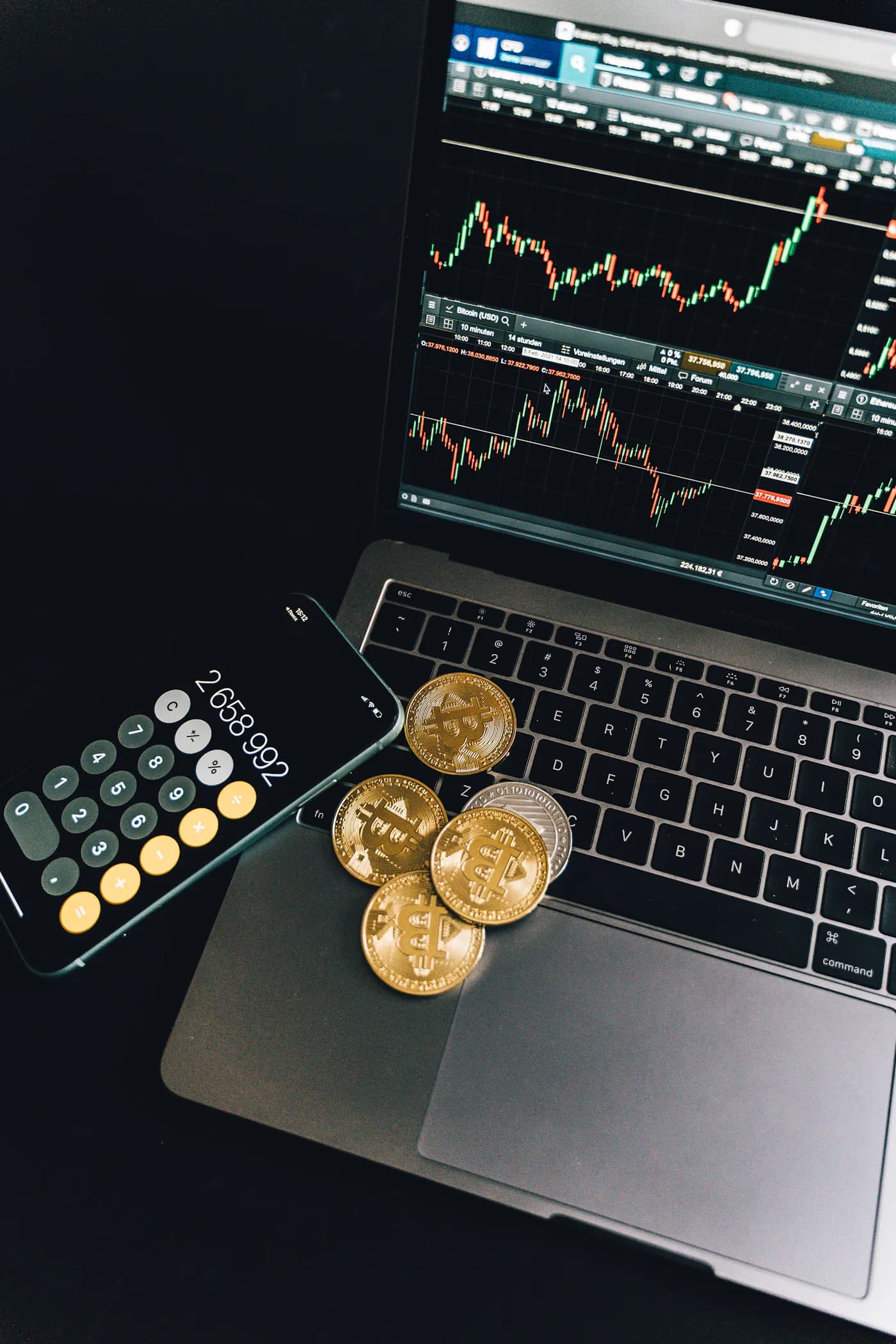 Execution desk with bitcoin coins, calculator, and management log.