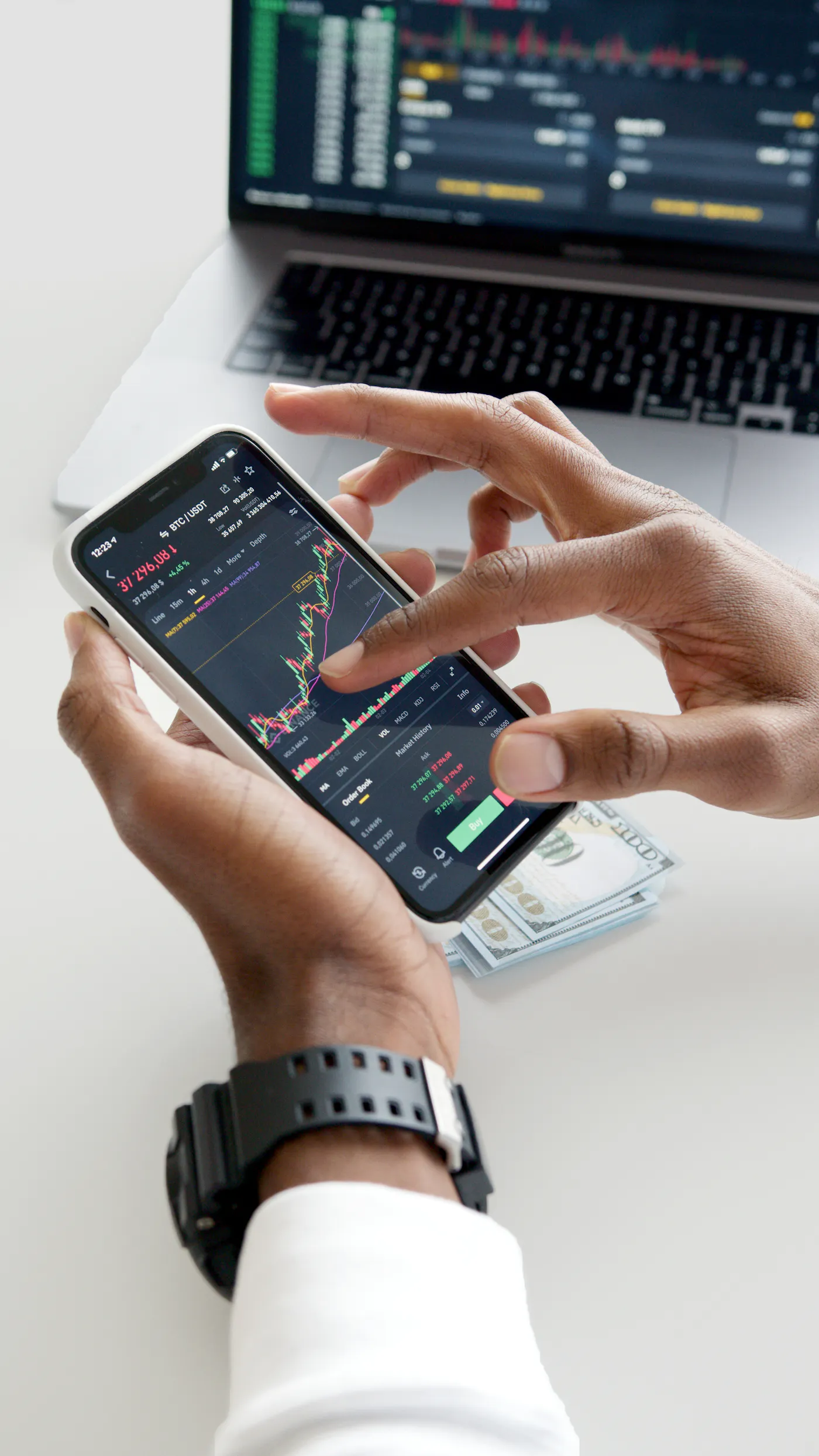 Smartphone displaying live trade management with bitcoin metrics.